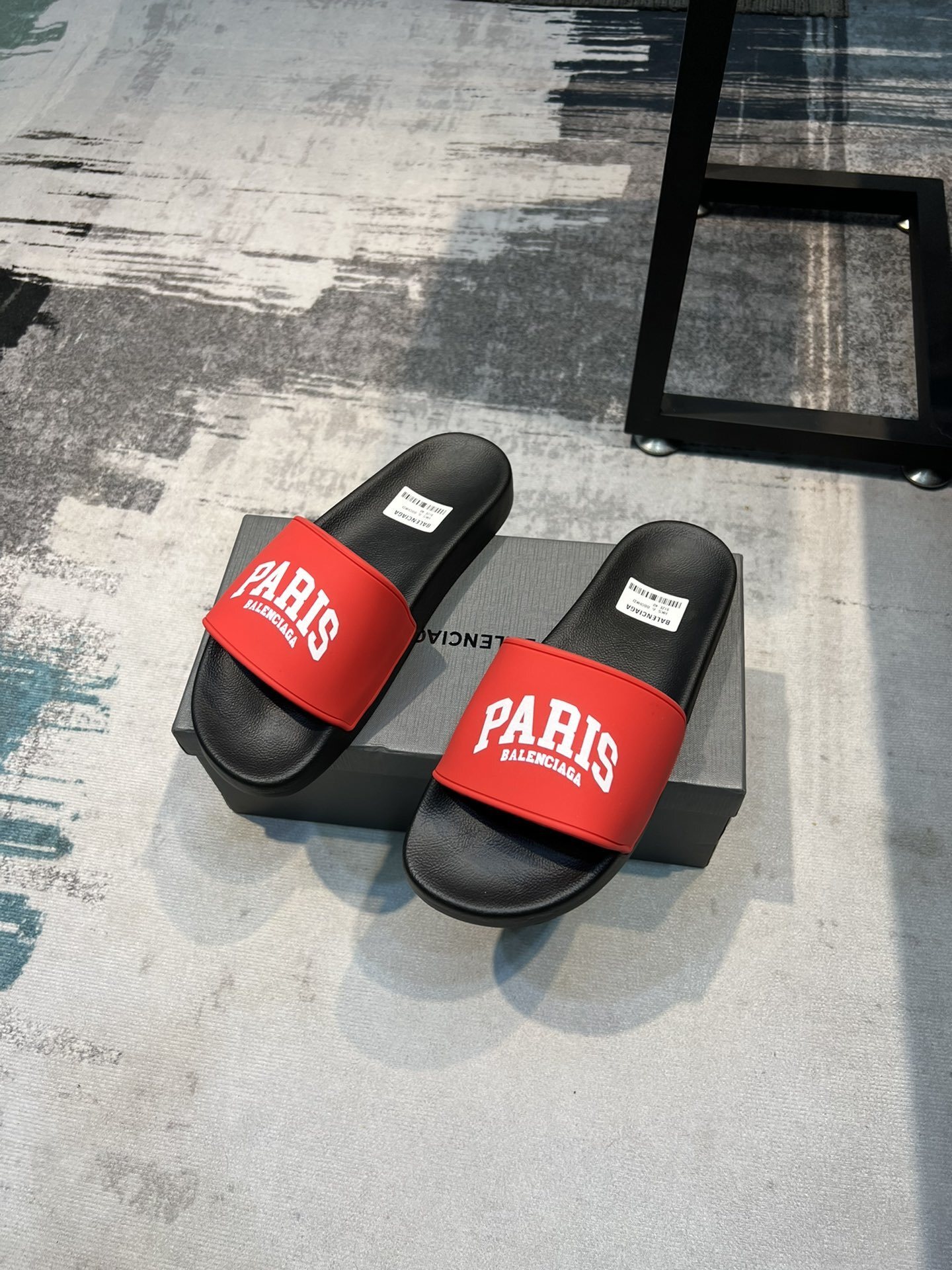Balenciaga Cities Pool Slide sandals in black with red "PARIS" branding