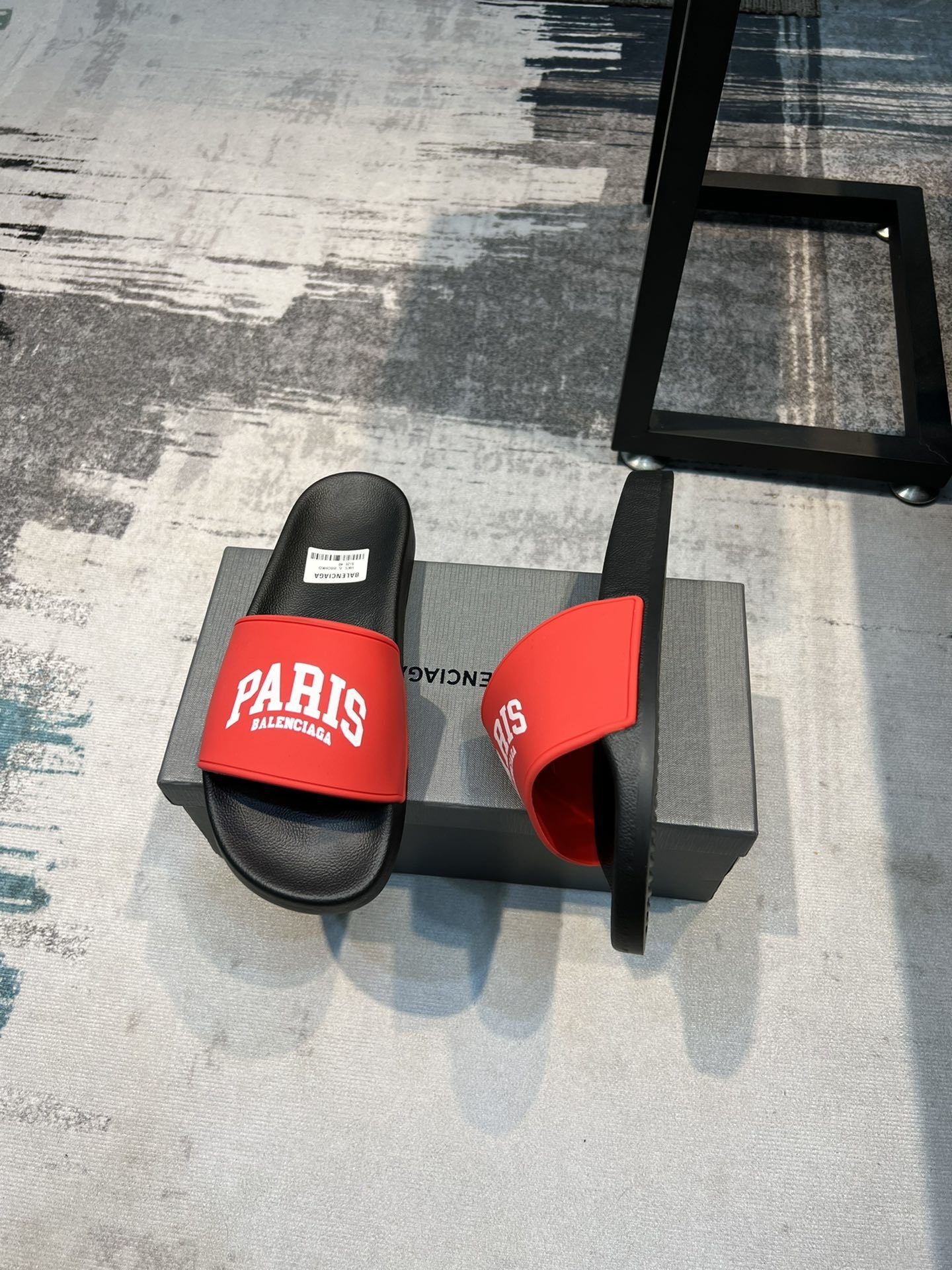 Balenciaga Cities Pool Slide sandals in black with red "PARIS" branding