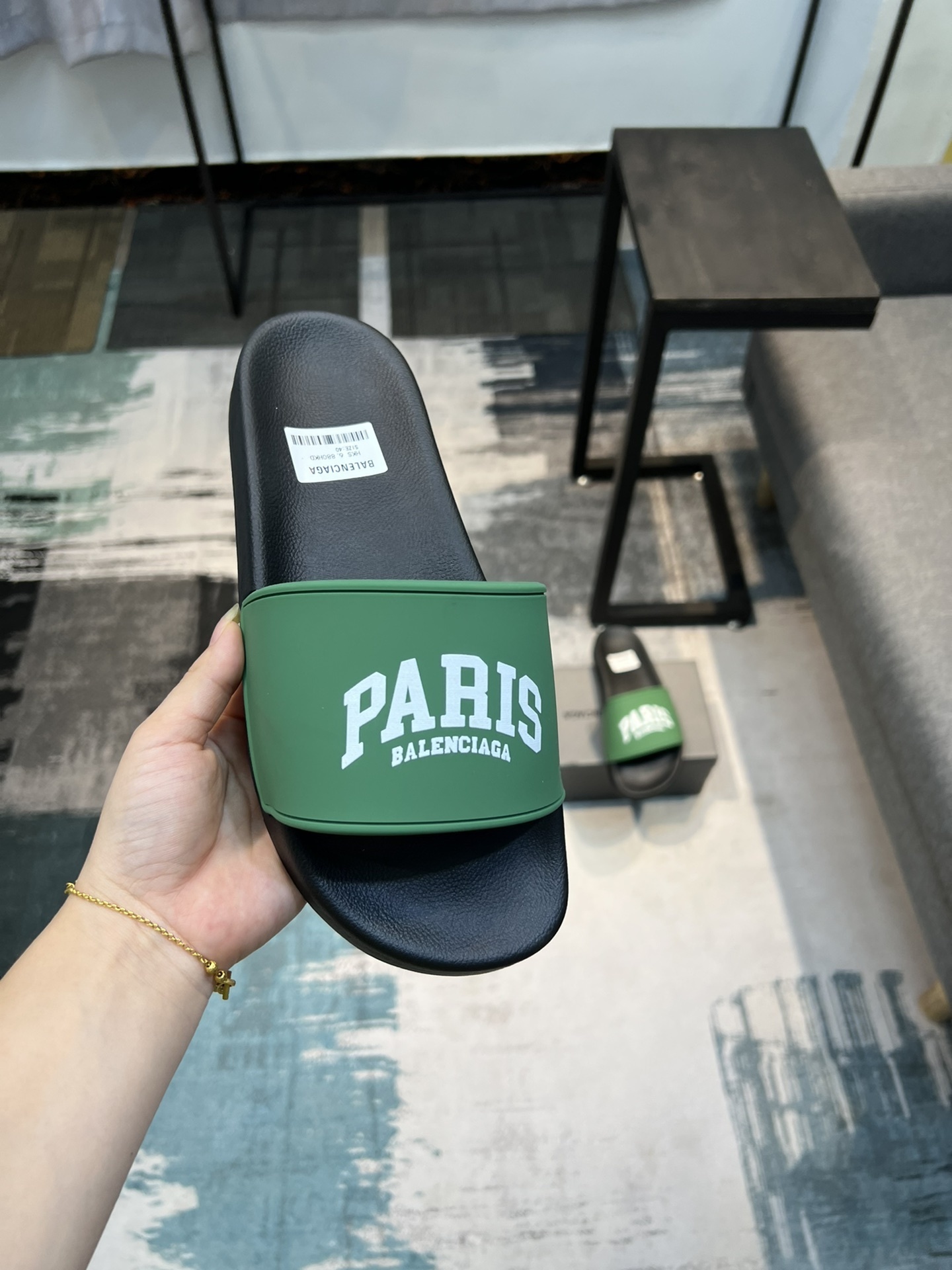 Balenciaga Paris pool slide sandals in green and black rubber.