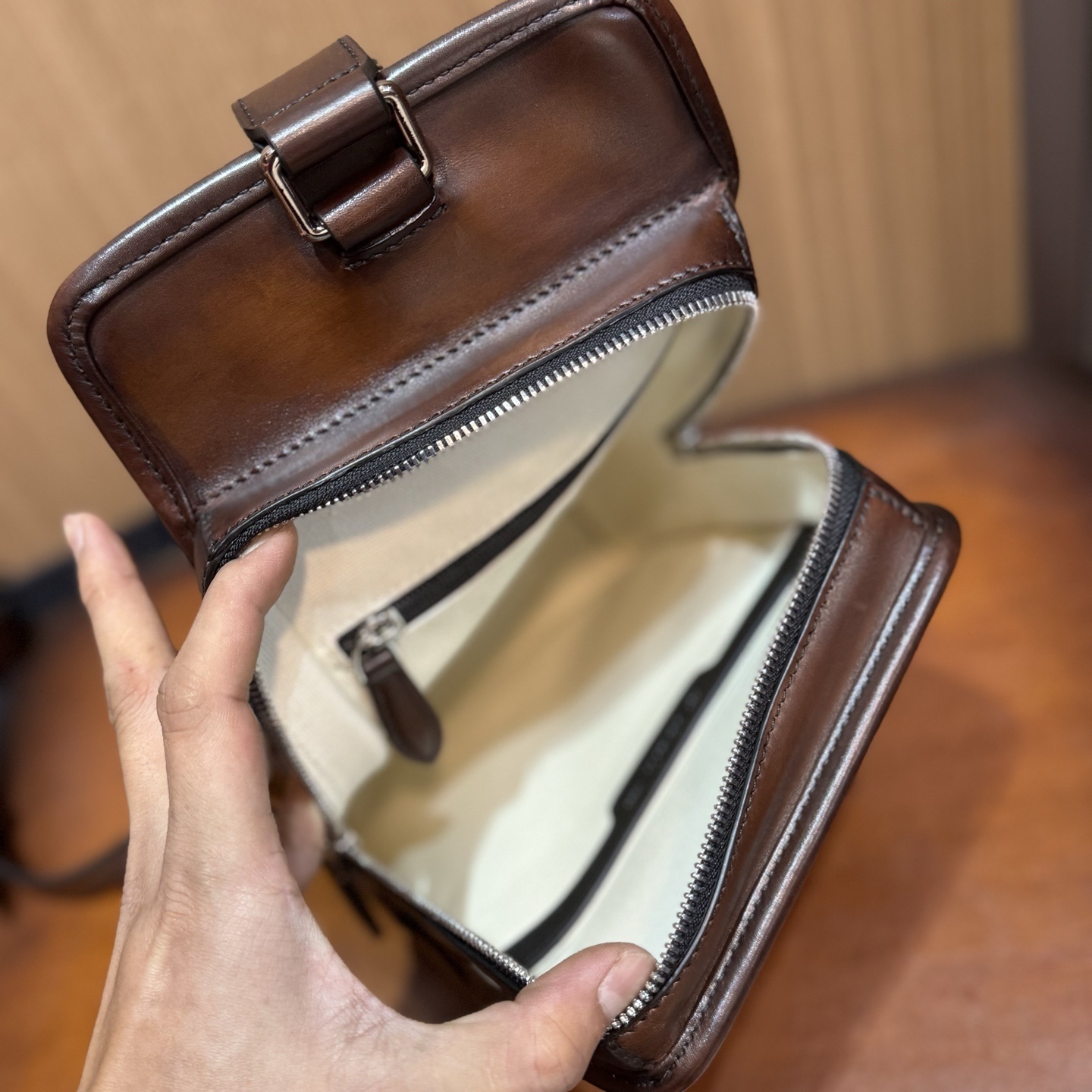 Berluti Périple sling bag in brown Venezia leather