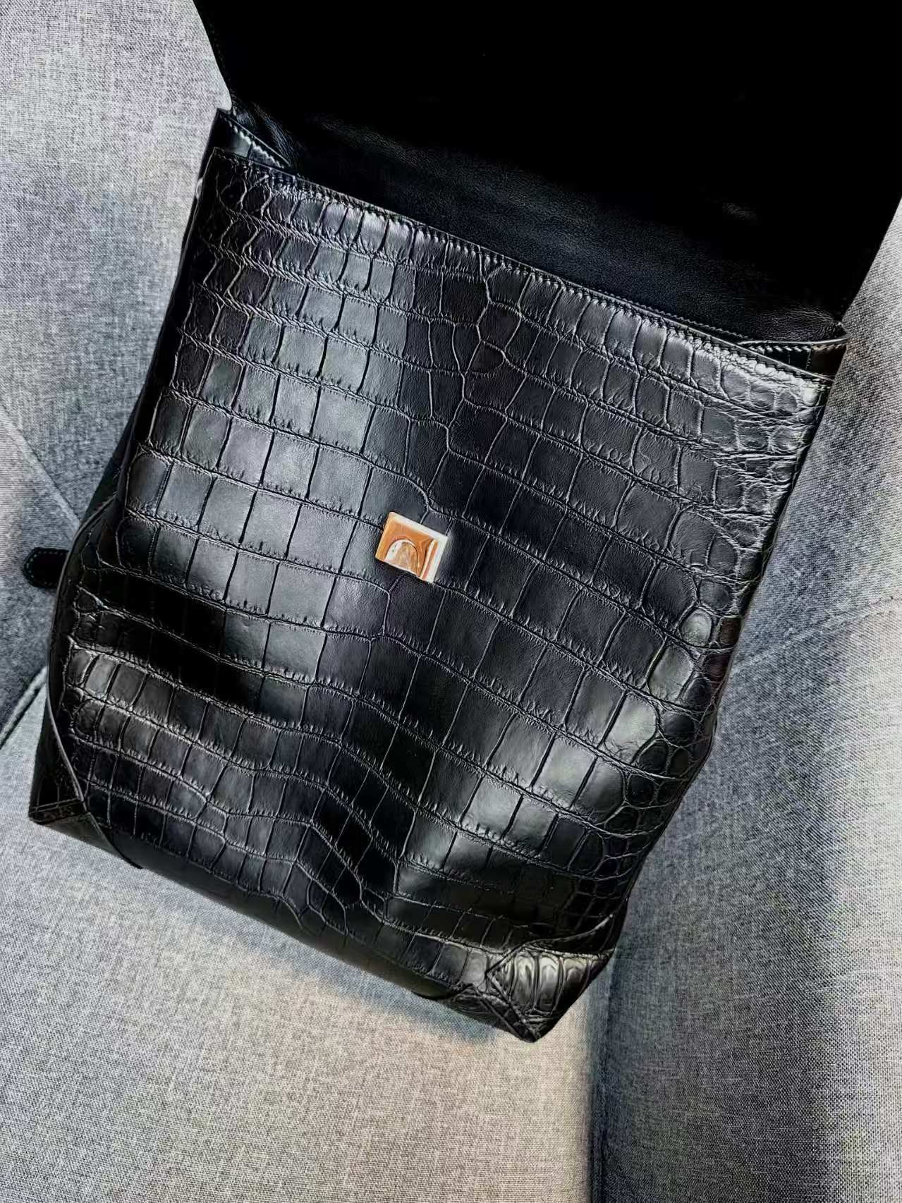 Saint Laurent Sac De Jour crocodile-embossed leather backpack in black