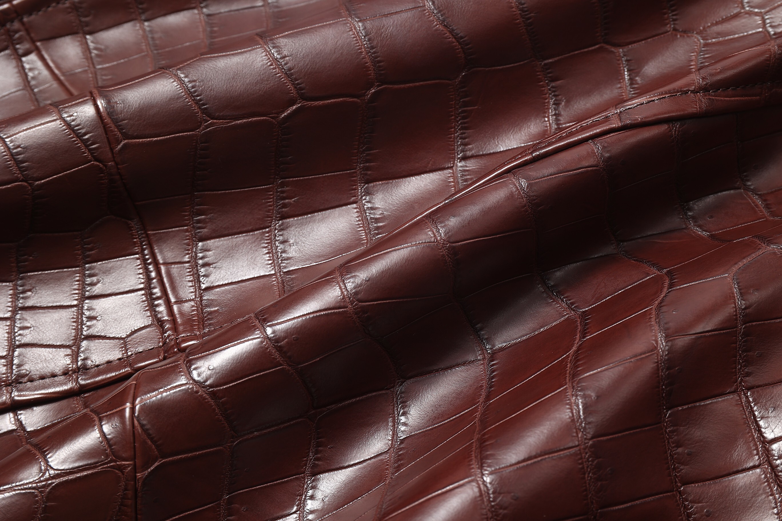Brioni brown leather bomber jacket with a crocodile-embossed pattern and a fur colla