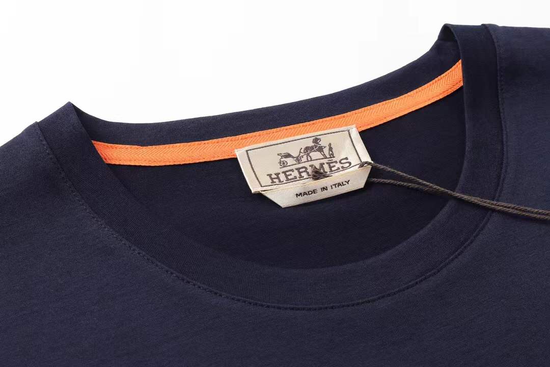 Hermès T-shirt with a light blue graphic print of the brand name and "PARIS" on the front