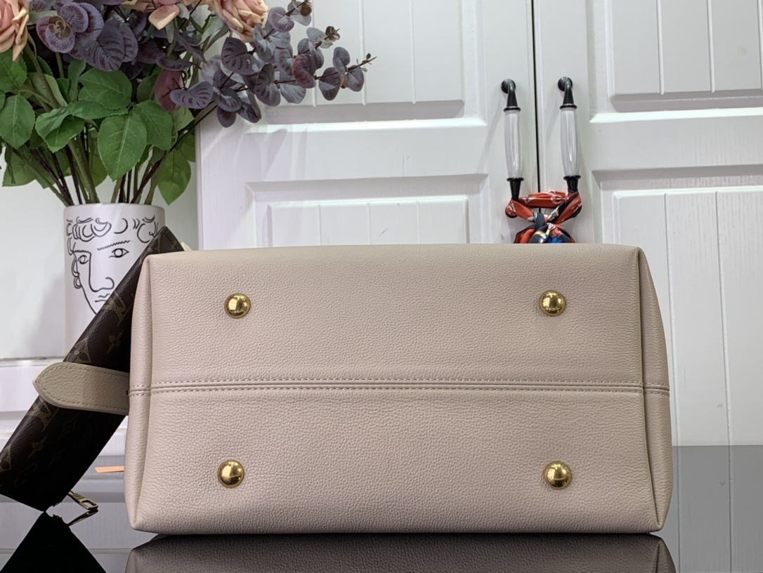 LV Low Key Hobo MM handbag in smooth grained calfskin leather and a limestone color