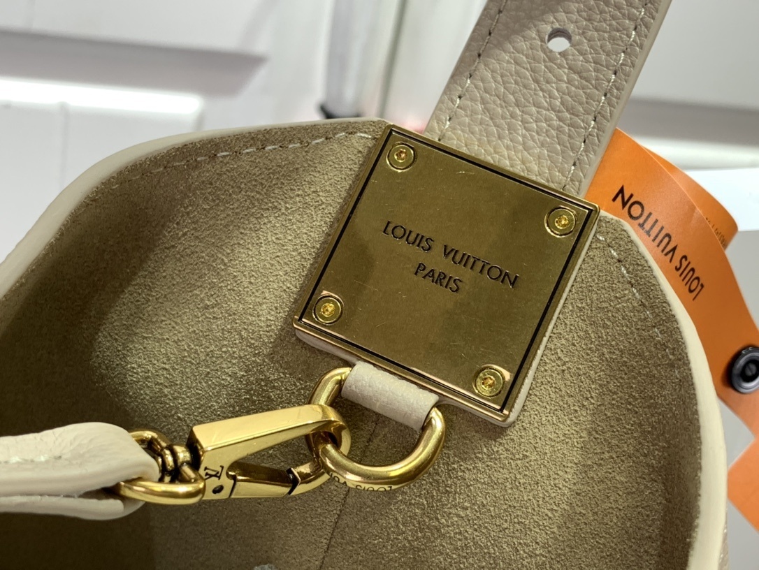 LV Low Key Hobo MM handbag in smooth grained calfskin leather and a limestone color