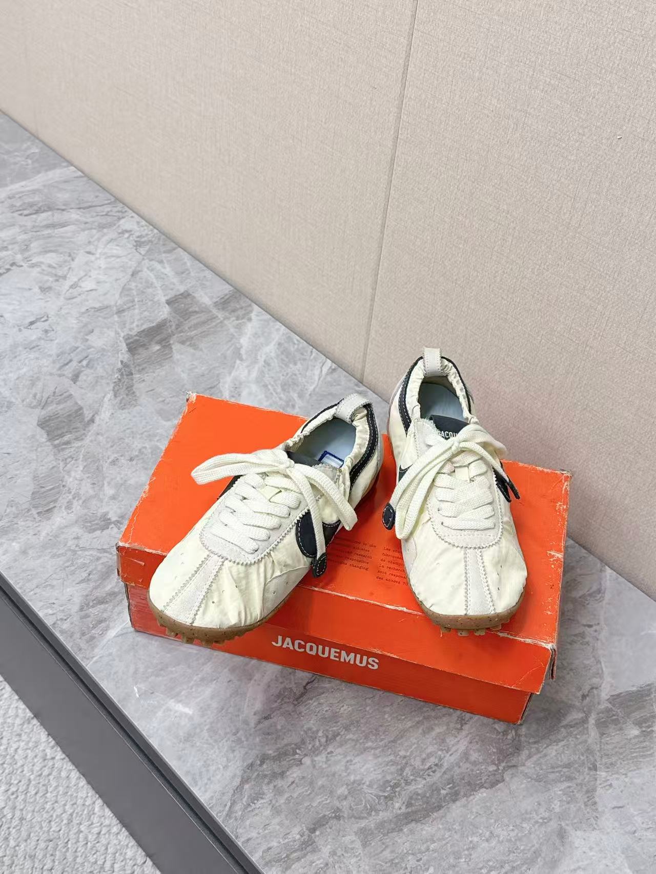 Nike x Jacquemus Moon Shoe SP in the Pale Yellow or Alabaster colorway