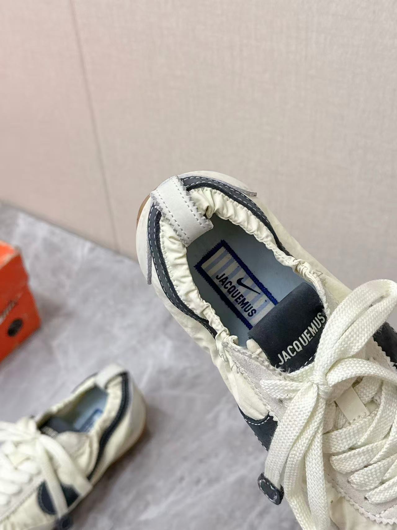 Nike x Jacquemus Moon Shoe SP in the Pale Yellow or Alabaster colorway