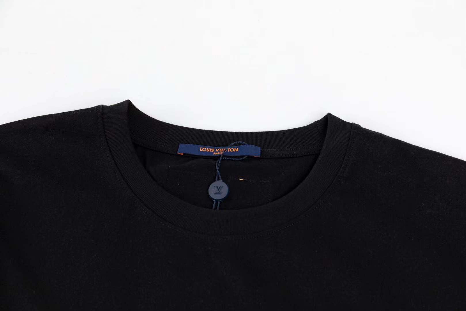 LV black short-sleeved t-shirt with a graphic of a cartoon tiger wearing sunglasses and holding a drink