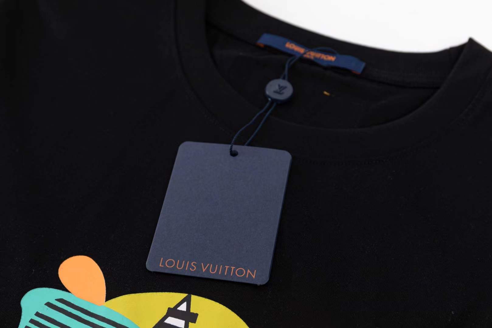 LV black short-sleeved t-shirt with a graphic of a cartoon tiger wearing sunglasses and holding a drink