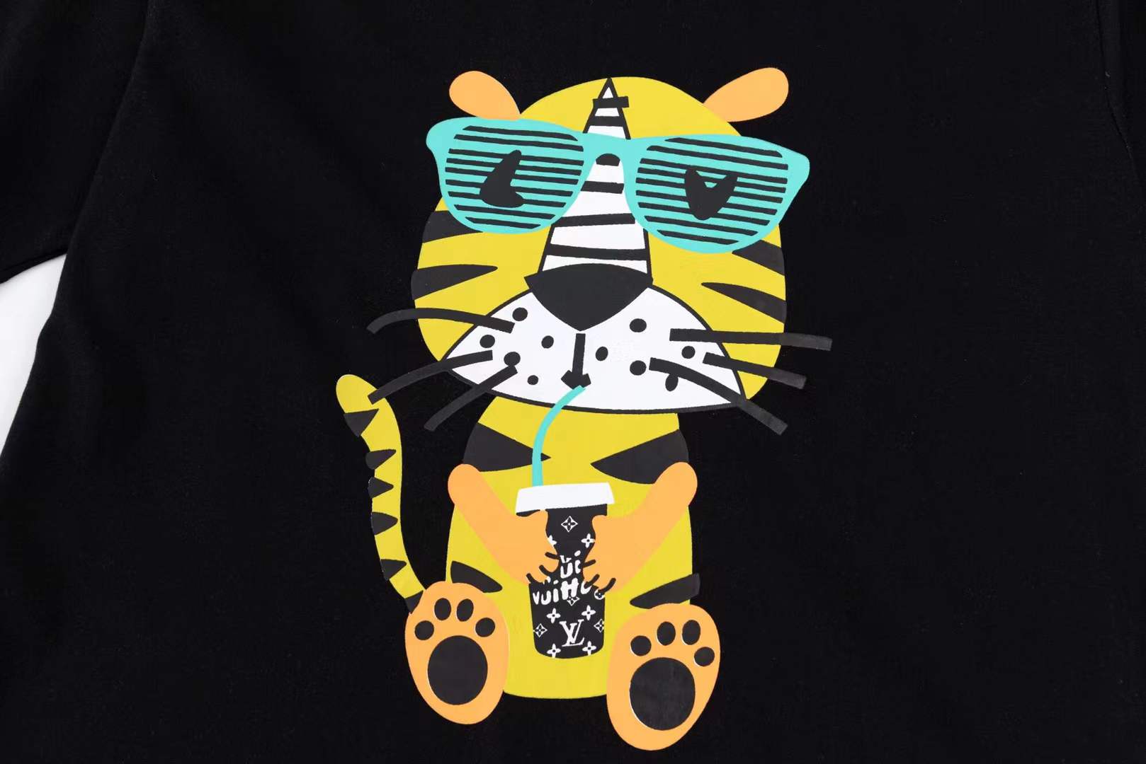 LV black short-sleeved t-shirt with a graphic of a cartoon tiger wearing sunglasses and holding a drink