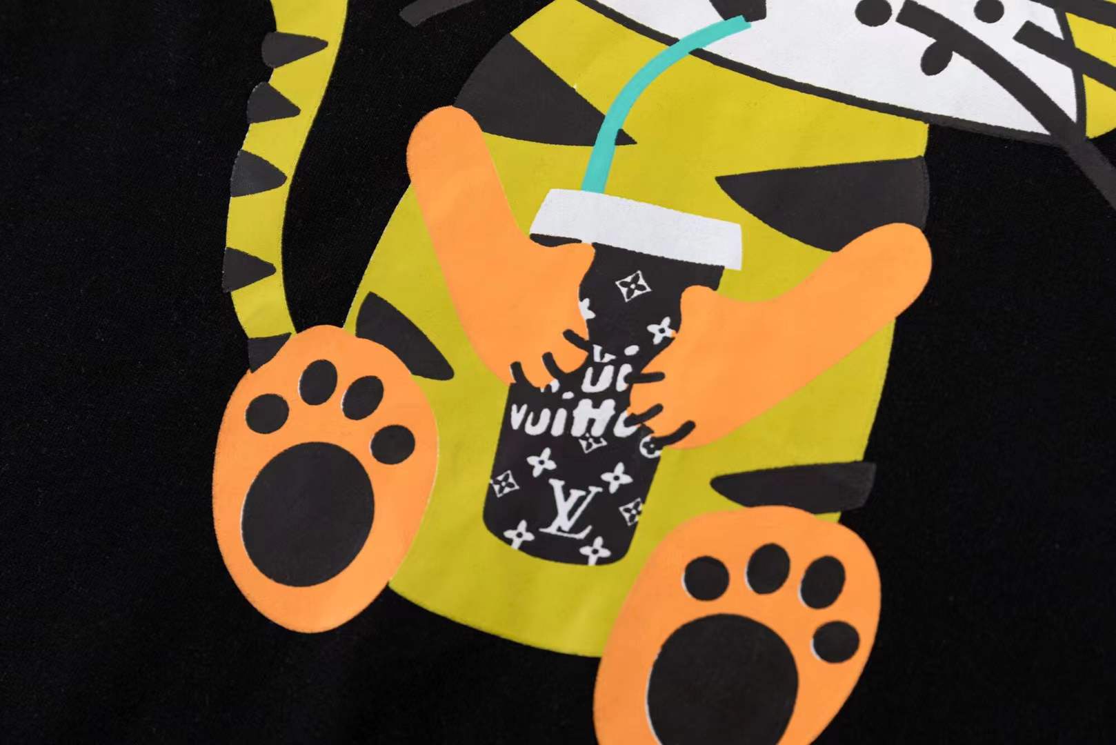 LV black short-sleeved t-shirt with a graphic of a cartoon tiger wearing sunglasses and holding a drink
