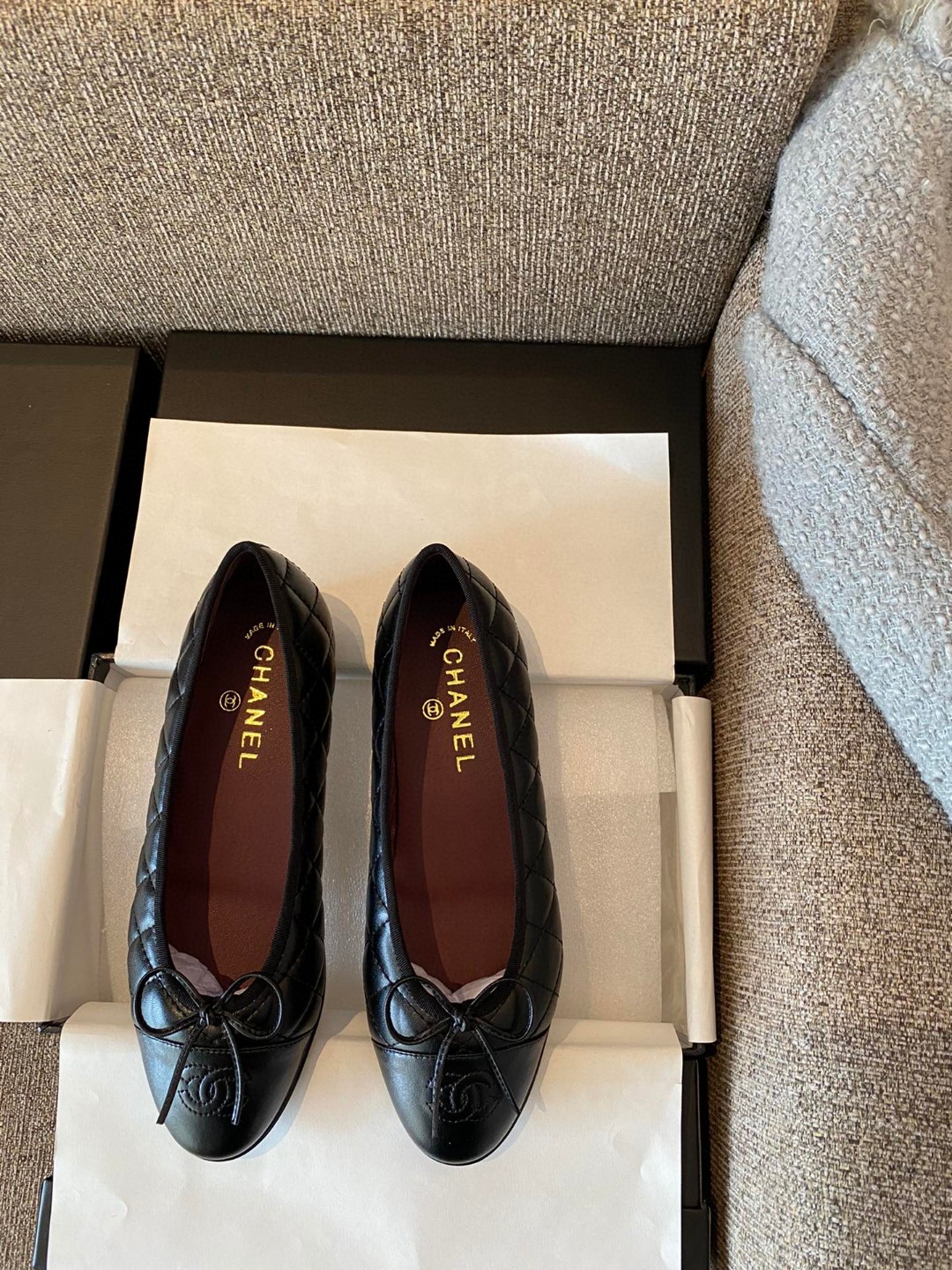 Chanel black aged calfskin quilted CC cap toe ballerina flats.