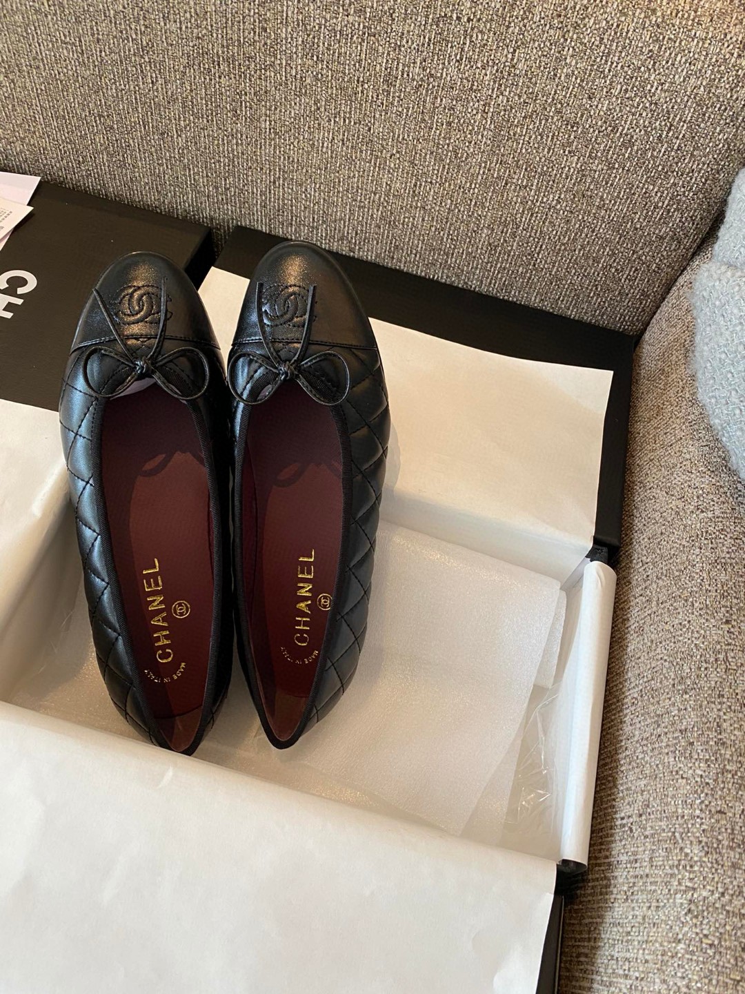 Chanel black aged calfskin quilted CC cap toe ballerina flats.