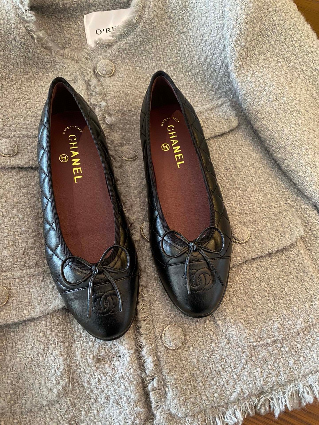 Chanel black aged calfskin quilted CC cap toe ballerina flats.