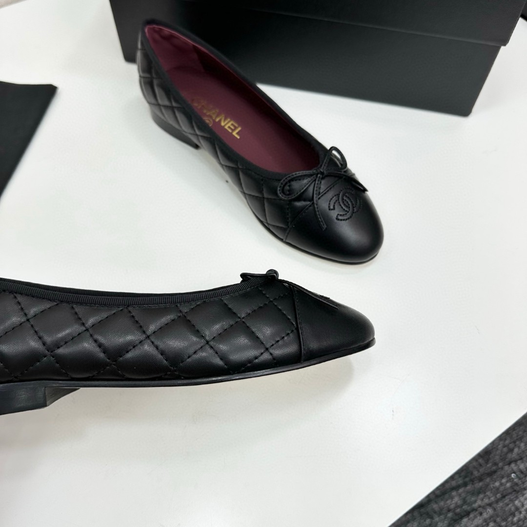 Chanel black aged calfskin quilted CC cap toe ballerina flats.