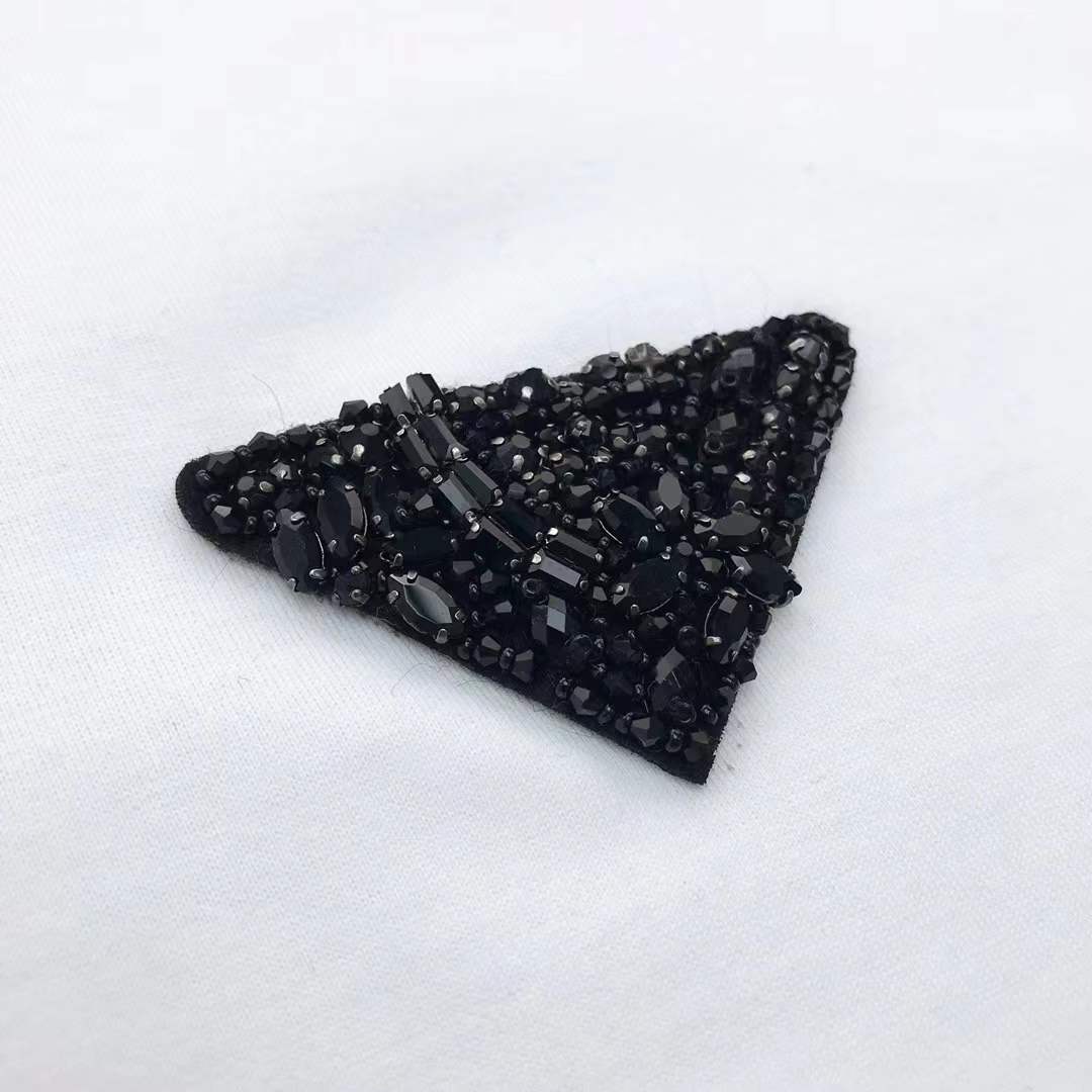 Prada cotton t-shirt white featuring the brand's iconic enameled metal triangle logo on the chest.