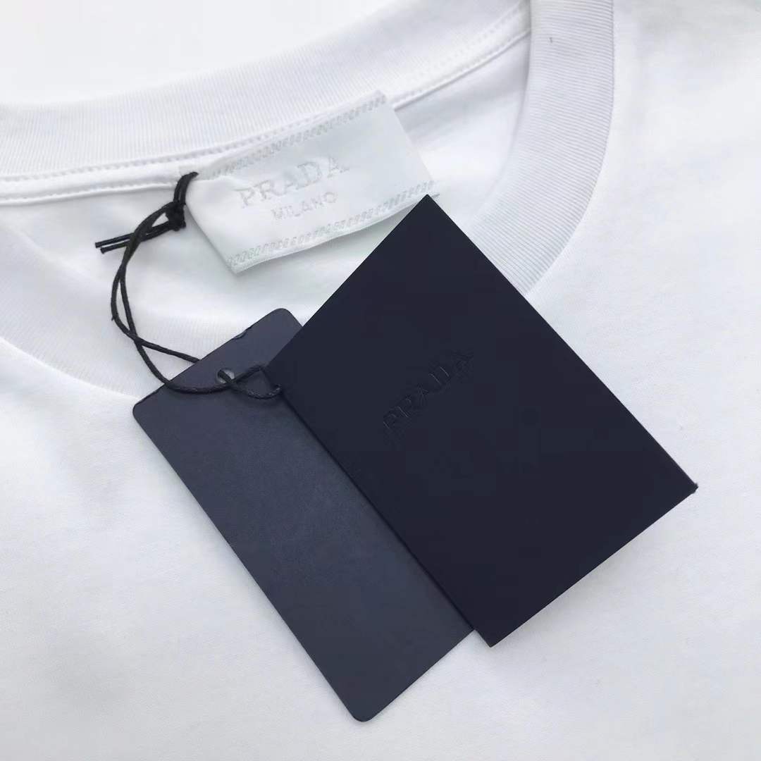 Prada cotton t-shirt white featuring the brand's iconic enameled metal triangle logo on the chest.