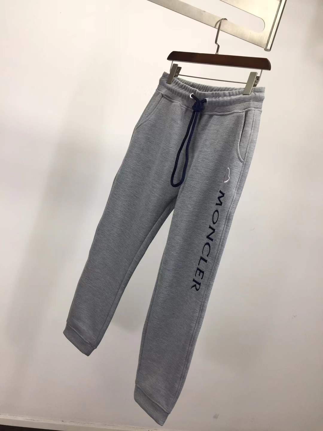 Moncler slim-fit tapered logo-embroidered loopback cotton-jersey sweatpants in grey.