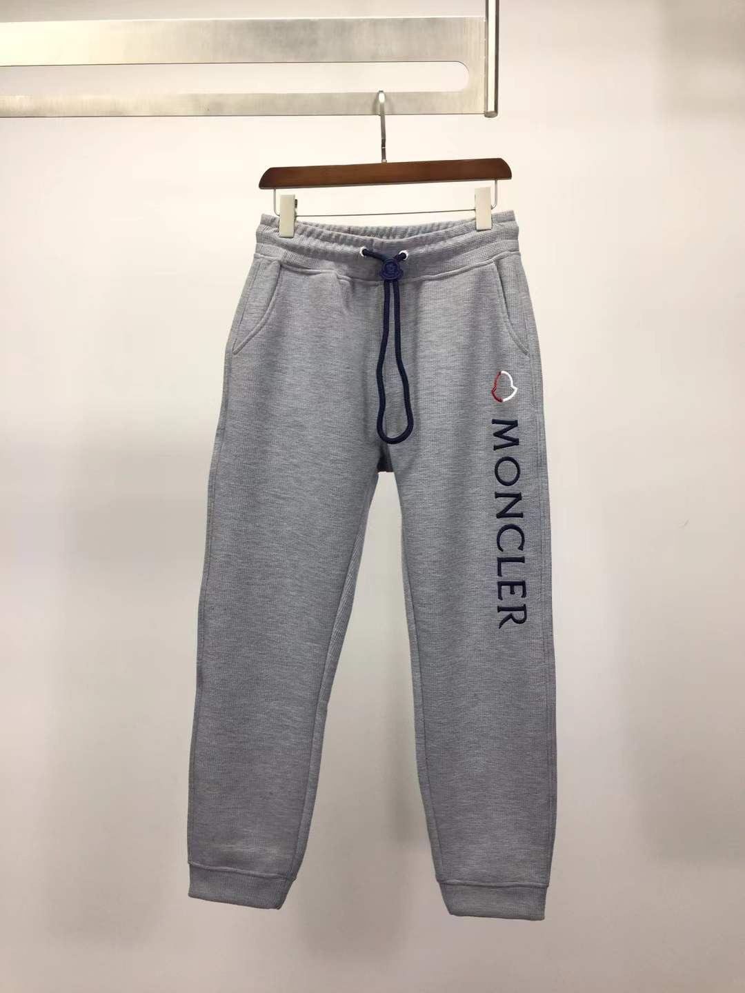Moncler slim-fit tapered logo-embroidered loopback cotton-jersey sweatpants in grey.