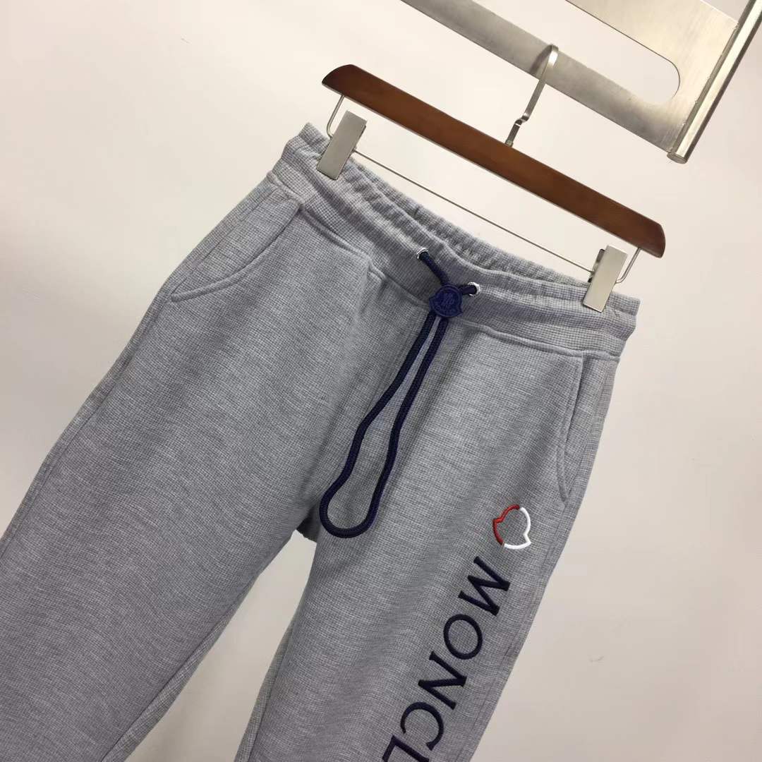 Moncler slim-fit tapered logo-embroidered loopback cotton-jersey sweatpants in grey.