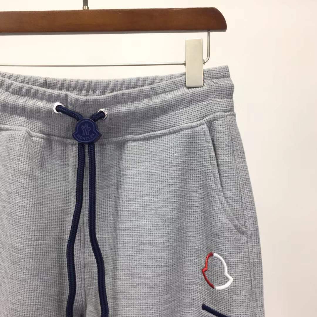 Moncler slim-fit tapered logo-embroidered loopback cotton-jersey sweatpants in grey.