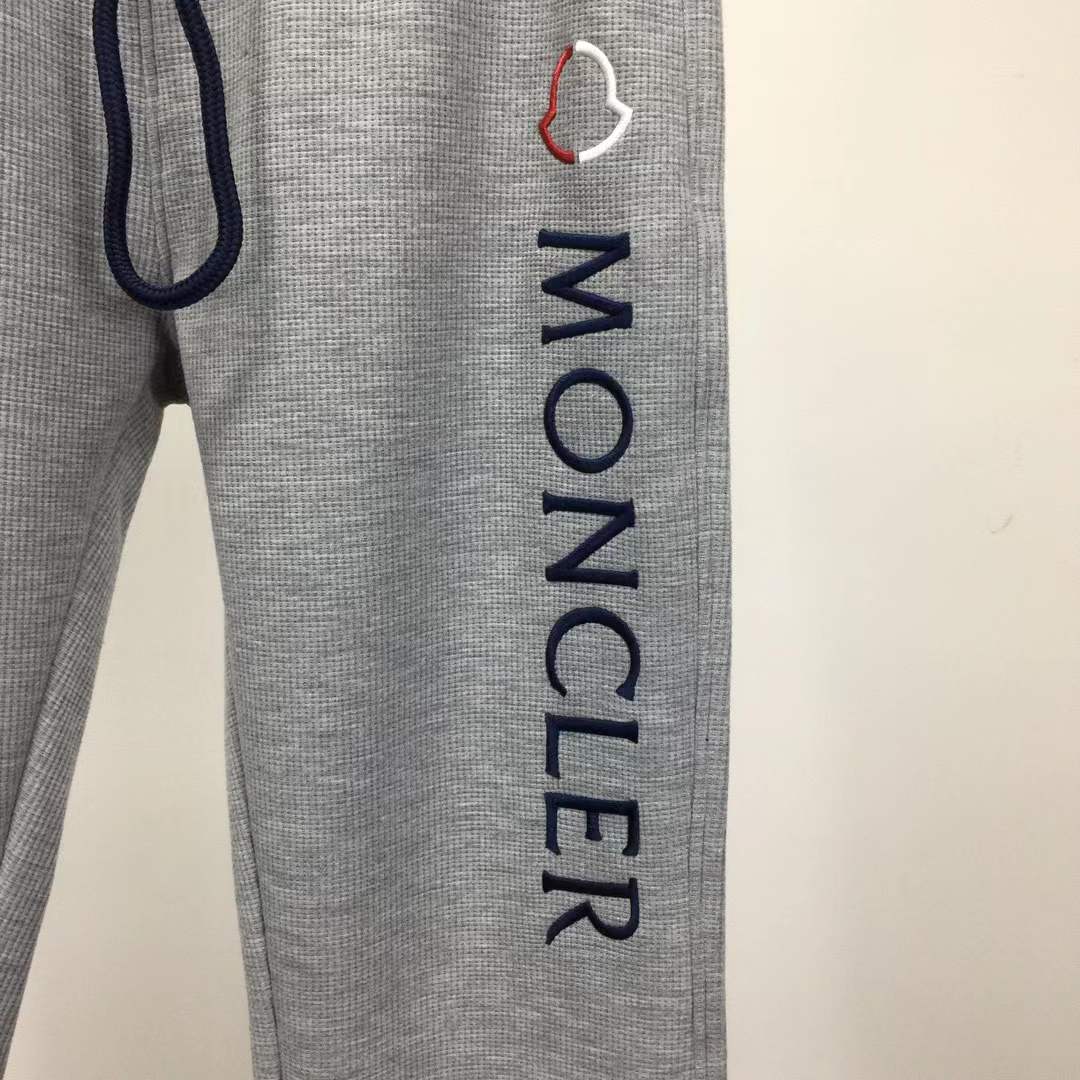 Moncler slim-fit tapered logo-embroidered loopback cotton-jersey sweatpants in grey.
