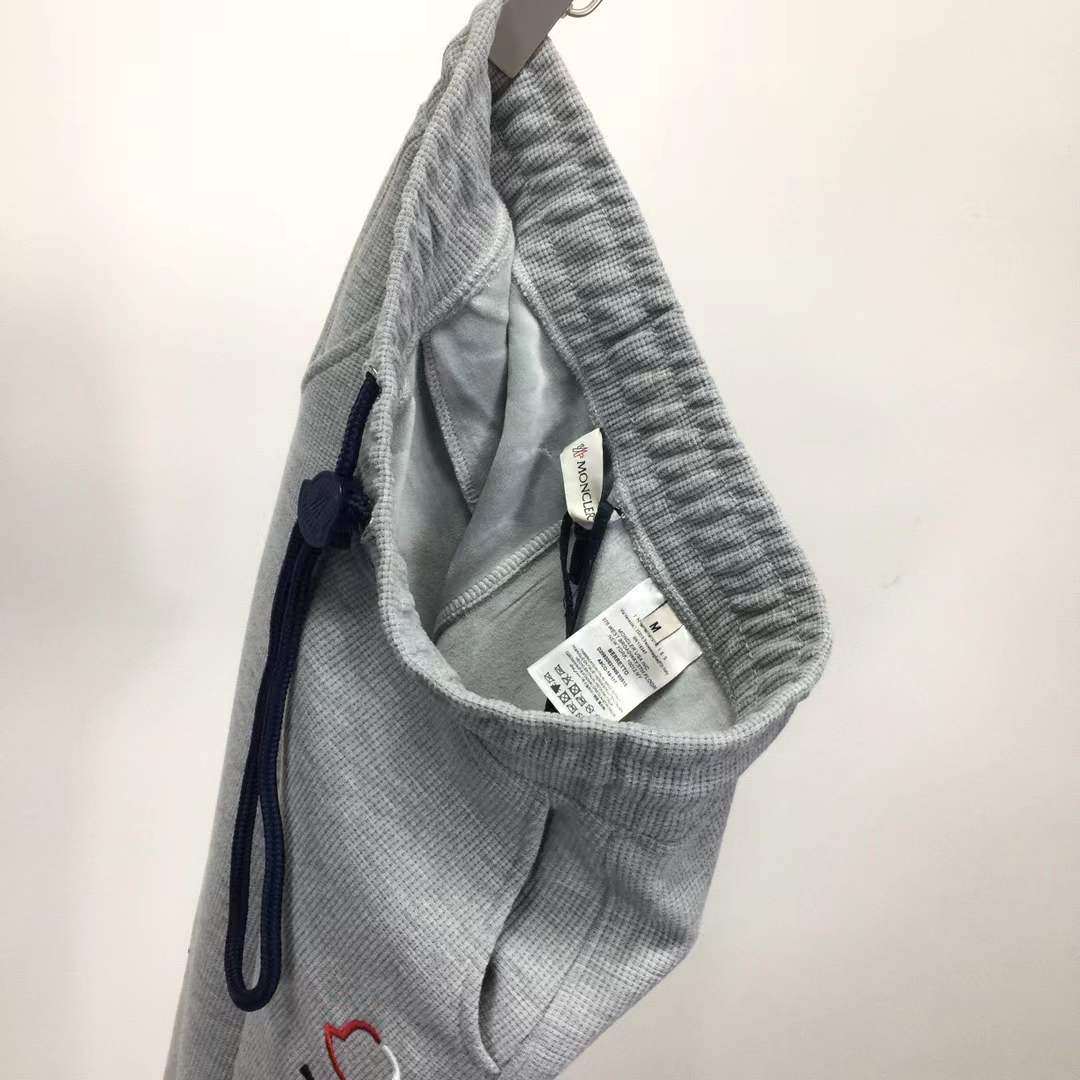 Moncler slim-fit tapered logo-embroidered loopback cotton-jersey sweatpants in grey.