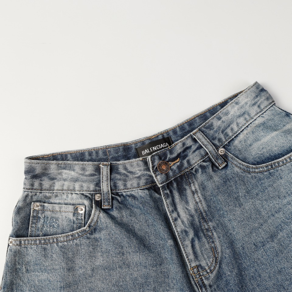 Balenciaga denim shorts featuring a "Paris" graphic and a sunset scene