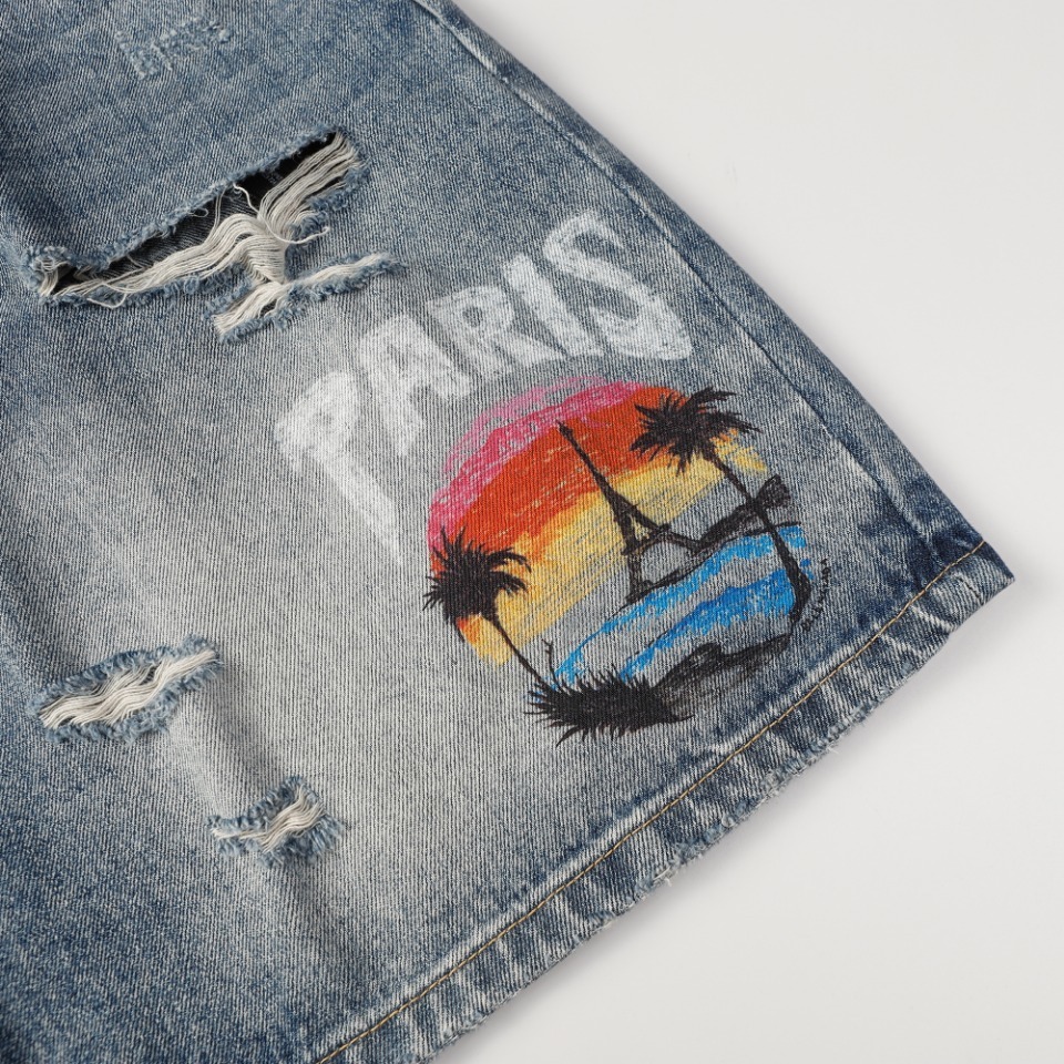 Balenciaga denim shorts featuring a "Paris" graphic and a sunset scene