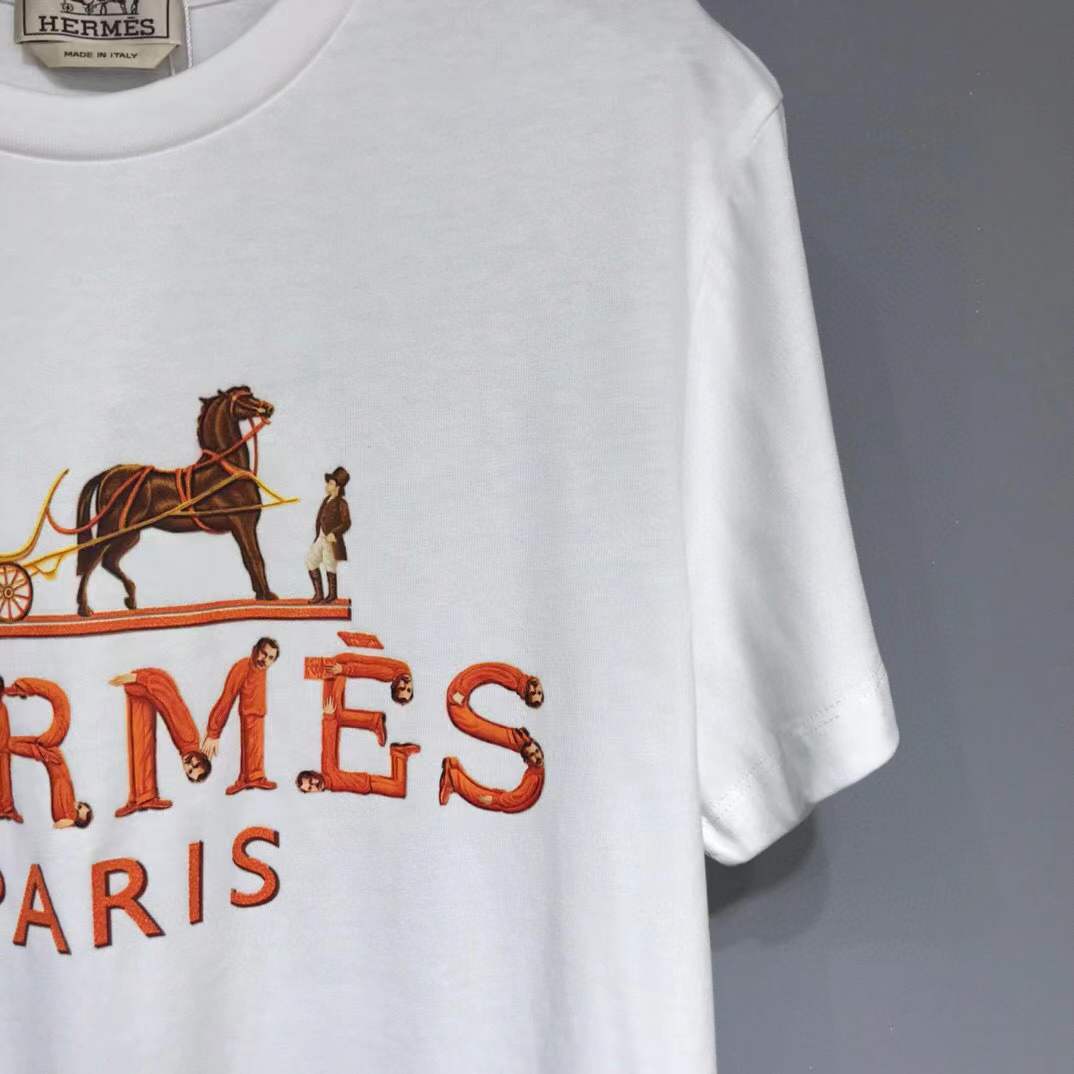 Hermes Paris t-shirt with an orange and yellow logo graphic.