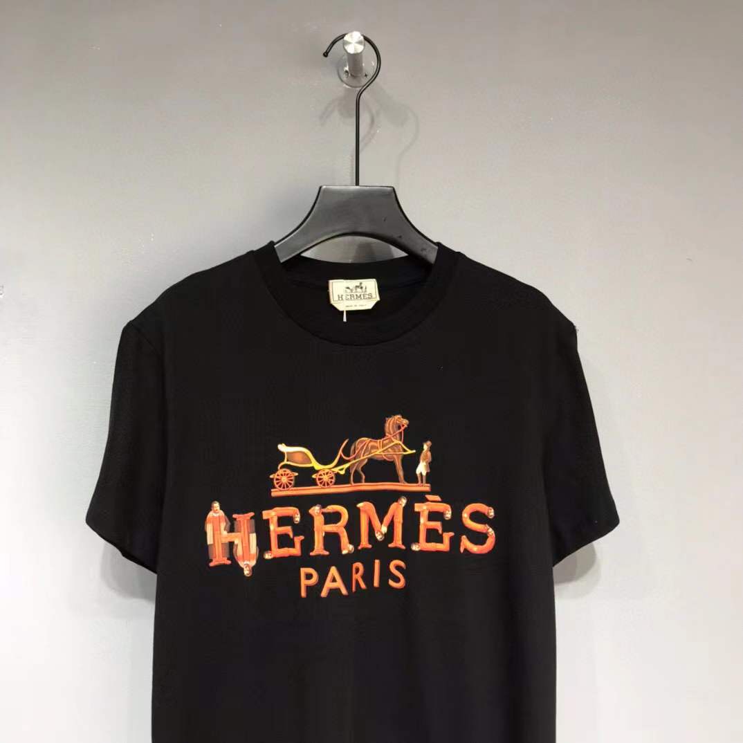 Hermes Paris t-shirt with an orange and yellow logo graphic.