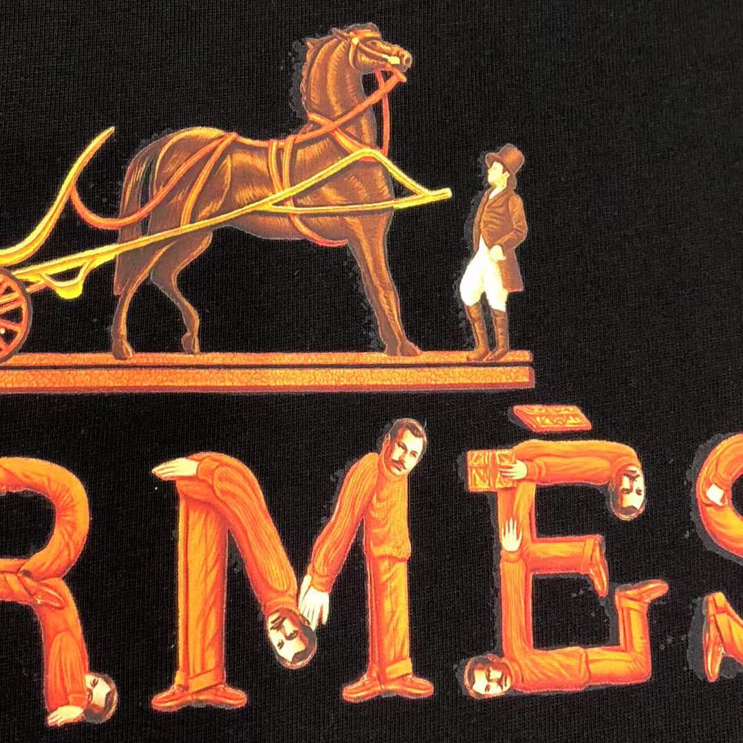 Hermes Paris t-shirt with an orange and yellow logo graphic.