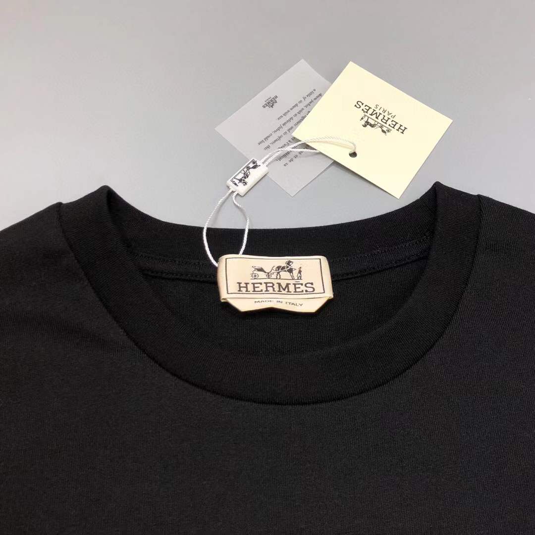 Hermes Paris t-shirt with an orange and yellow logo graphic.