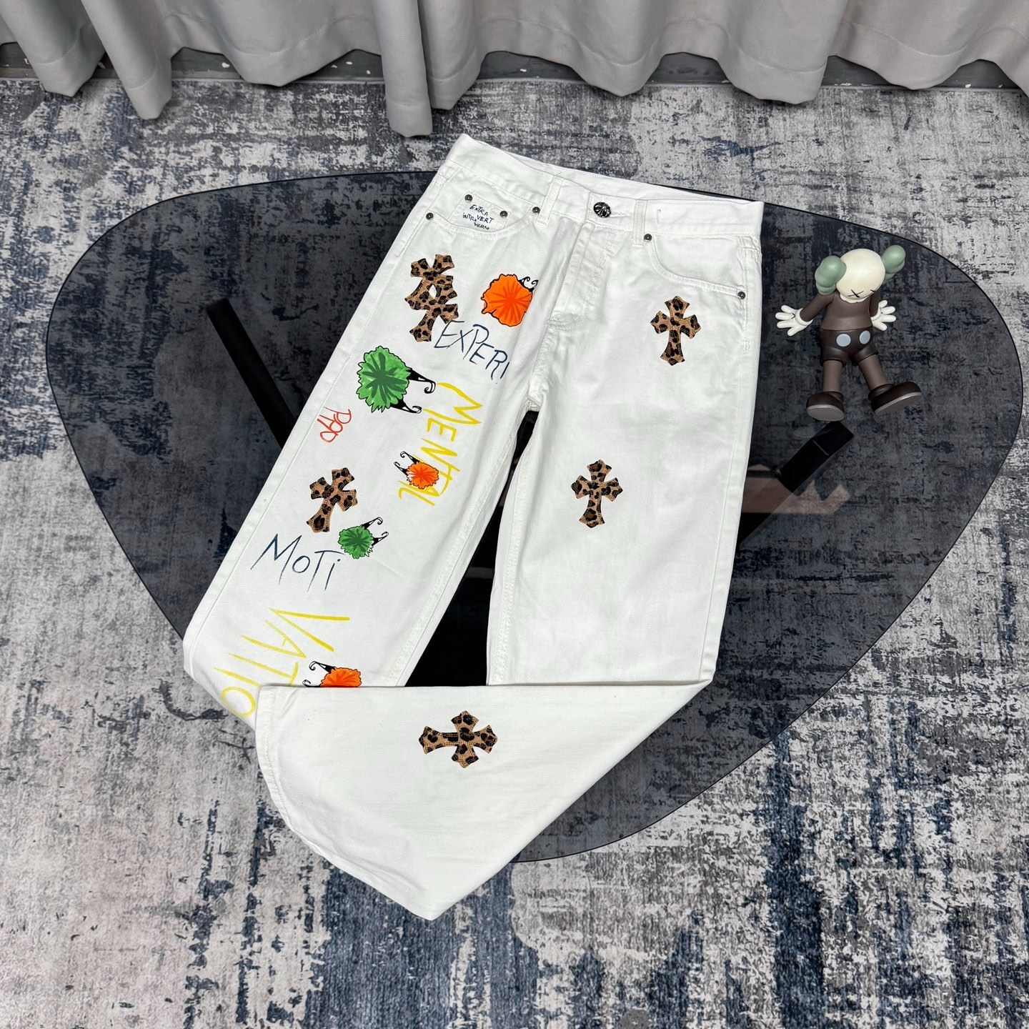 Chrome Hearts Matty Boy custom painted Levi's cross patch jeans in white denim with leopard print crosses.