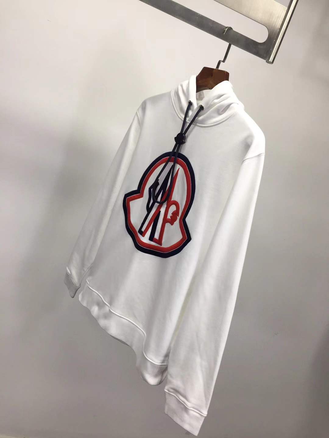 Moncler cotton hoodie with a large, two-tone embroidered logo on the front