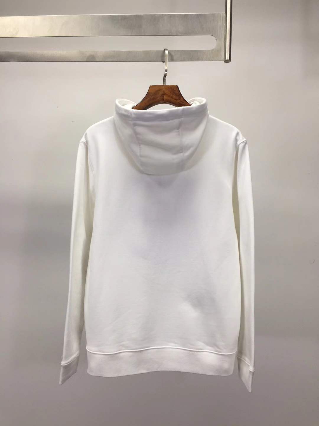 Moncler cotton hoodie with a large, two-tone embroidered logo on the front