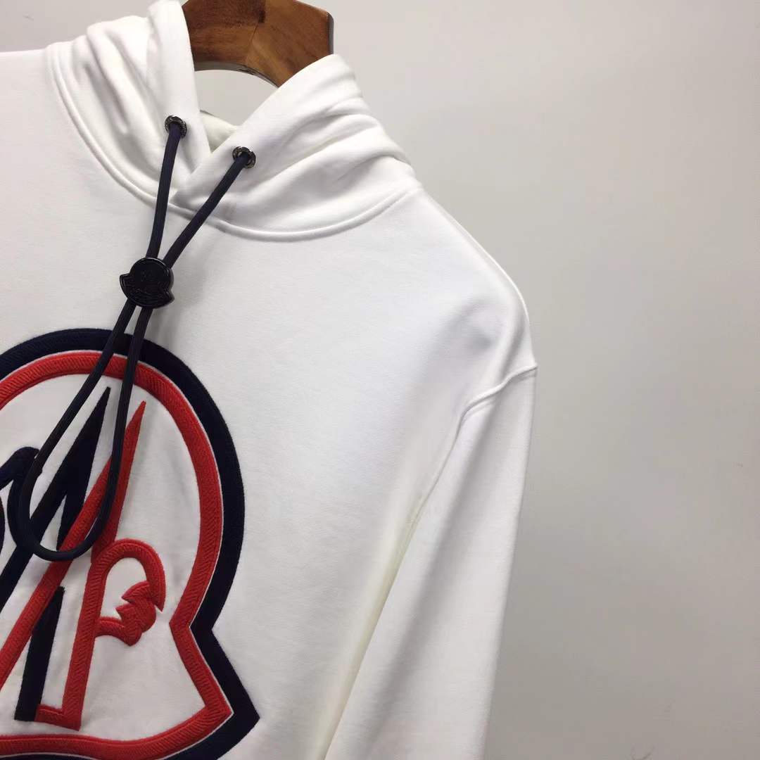 Moncler cotton hoodie with a large, two-tone embroidered logo on the front