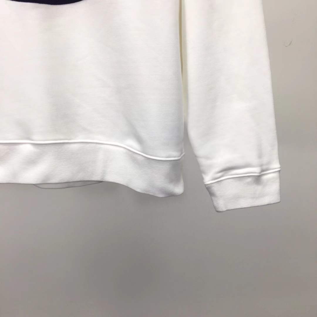 Moncler cotton hoodie with a large, two-tone embroidered logo on the front