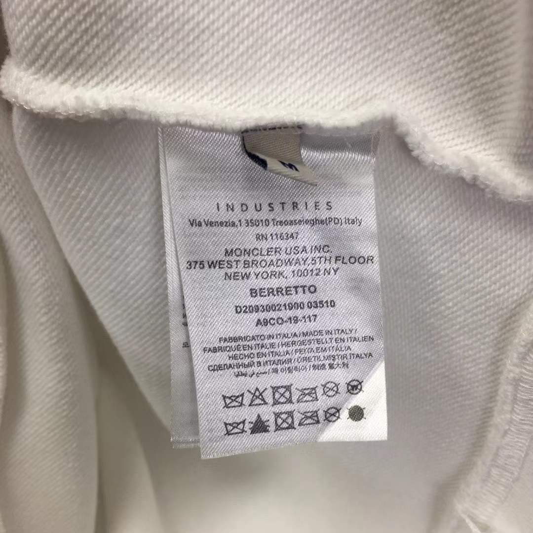 Moncler cotton hoodie with a large, two-tone embroidered logo on the front