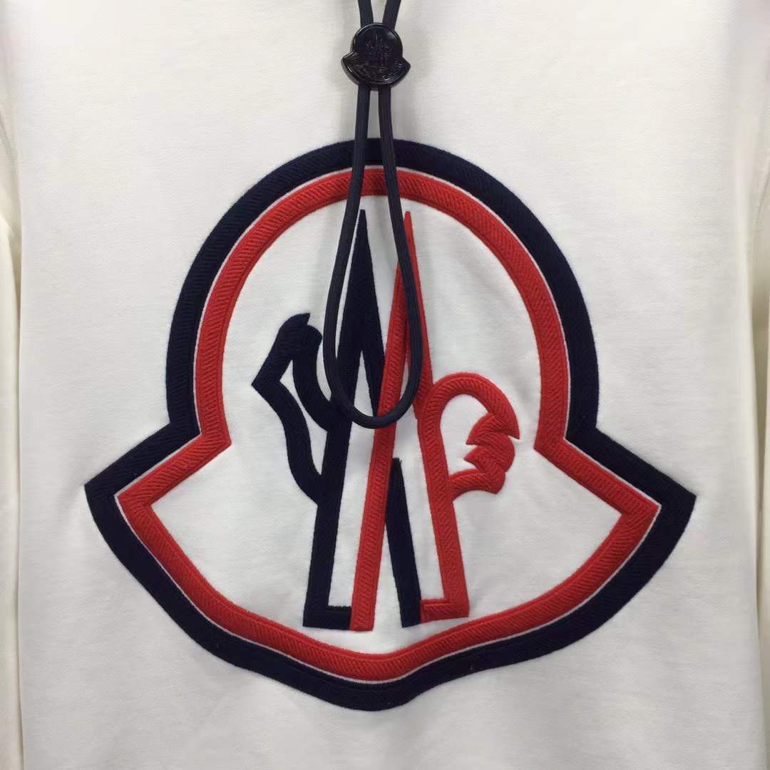 Moncler cotton hoodie with a large, two-tone embroidered logo on the front