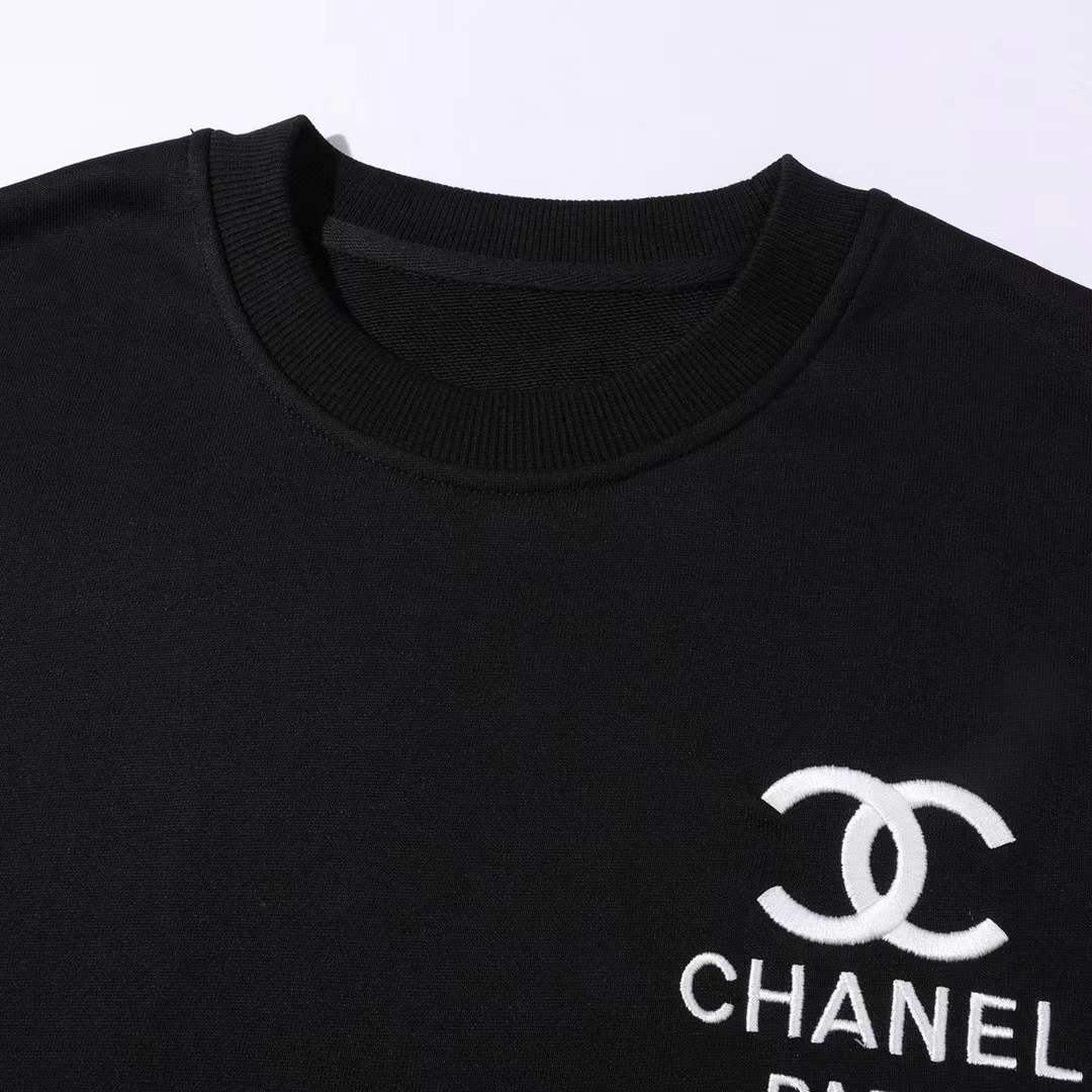 Chanel crewneck sweatshirt with the logo and "PARIS" text on the chest, and the number "5" on the sleeve