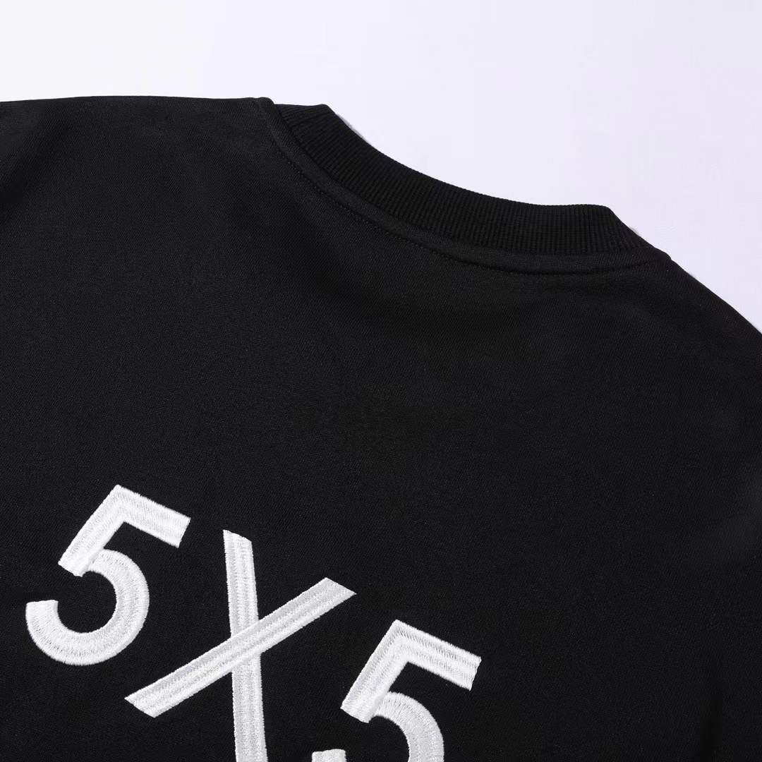 Chanel crewneck sweatshirt with the logo and "PARIS" text on the chest, and the number "5" on the sleeve