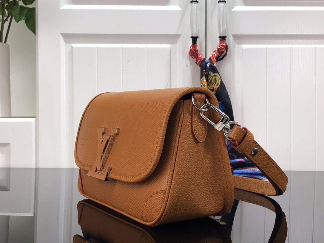 LV Buci bag crafted from textured Epi leather in a golden honey brown color