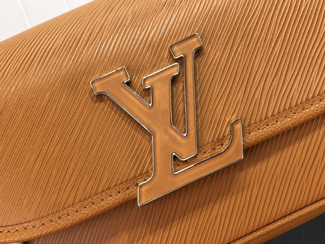 LV Buci bag crafted from textured Epi leather in a golden honey brown color