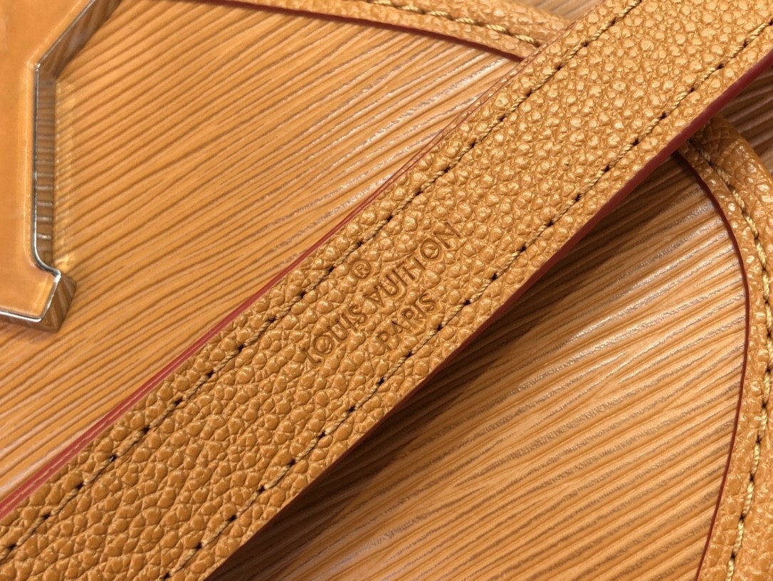 LV Buci bag crafted from textured Epi leather in a golden honey brown color