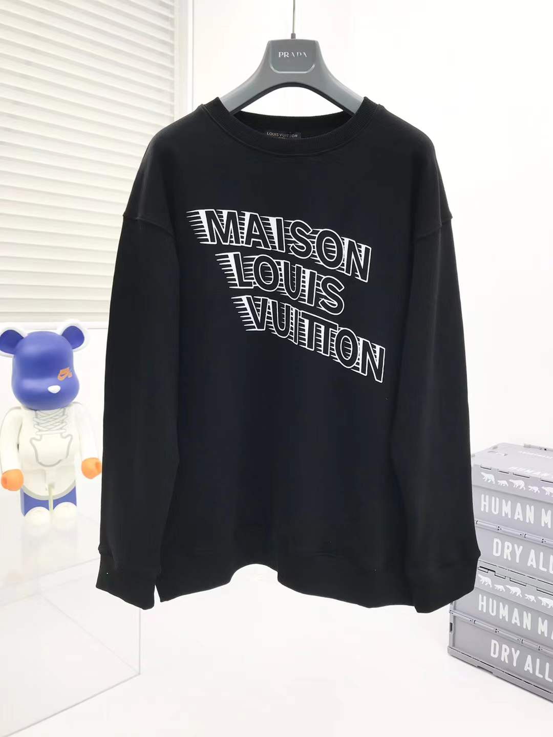 LV sweatshirt featuring a stylized "Maison Louis Vuitton" logo on the chest