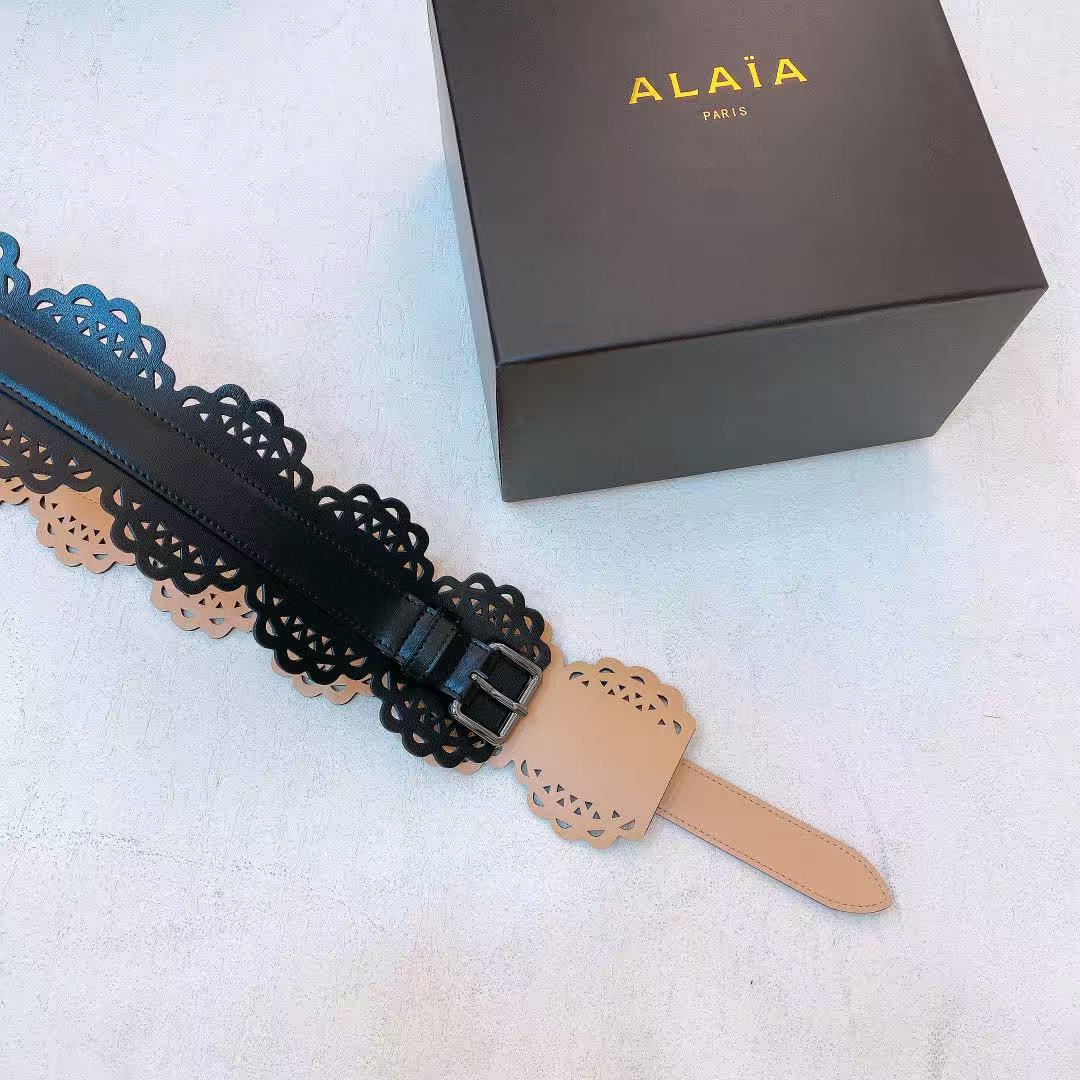Alaïa black leather laser-cut waist belt.