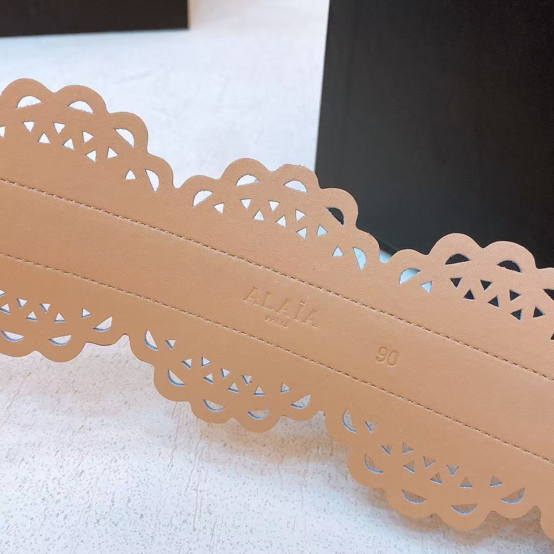 Alaïa black leather laser-cut waist belt.