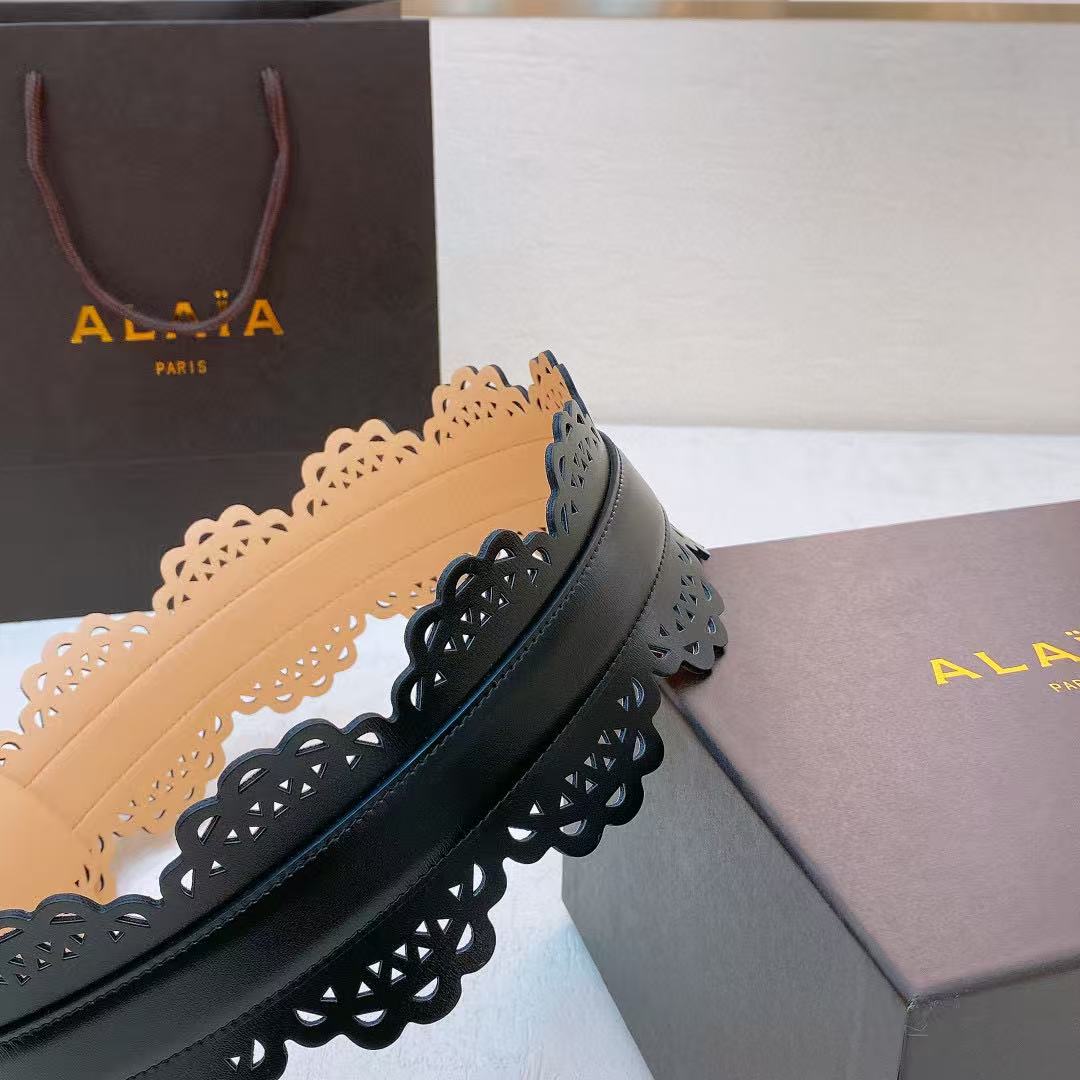 Alaïa black leather laser-cut waist belt.