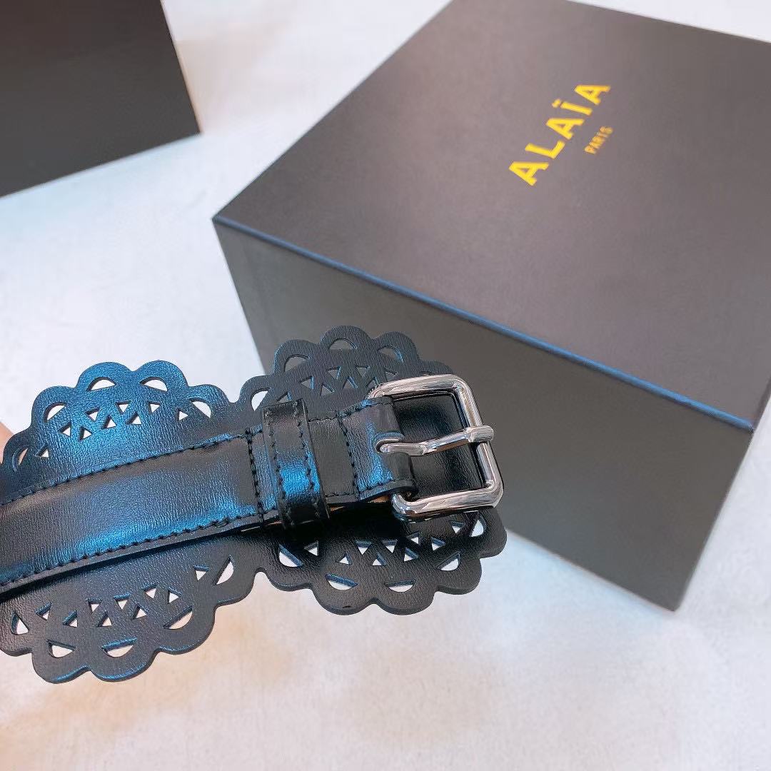 Alaïa black leather laser-cut waist belt.